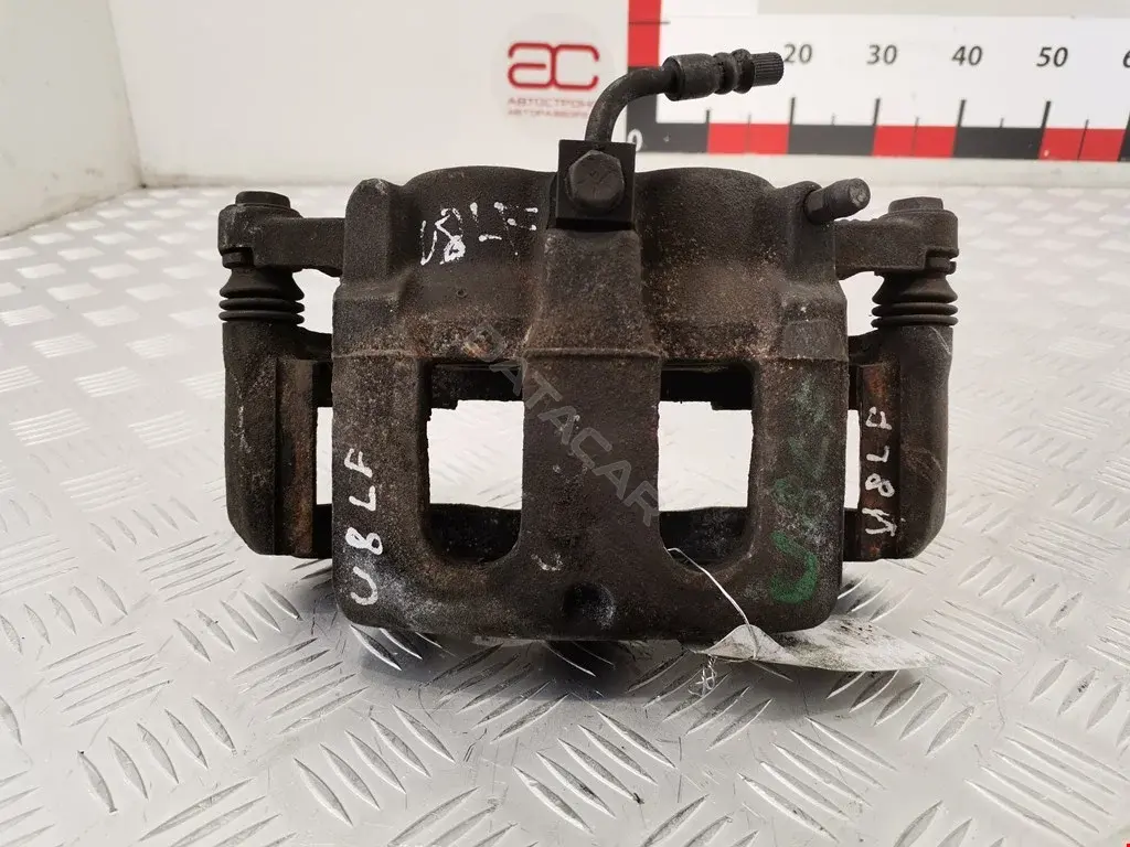 Суппорт тормозной 8A8Z2B121AA