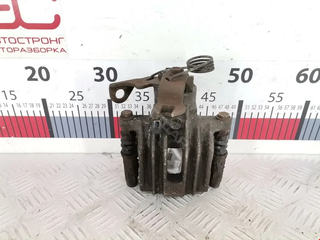 Суппорт тормозной 0590083SX, 0986474830, 100310002