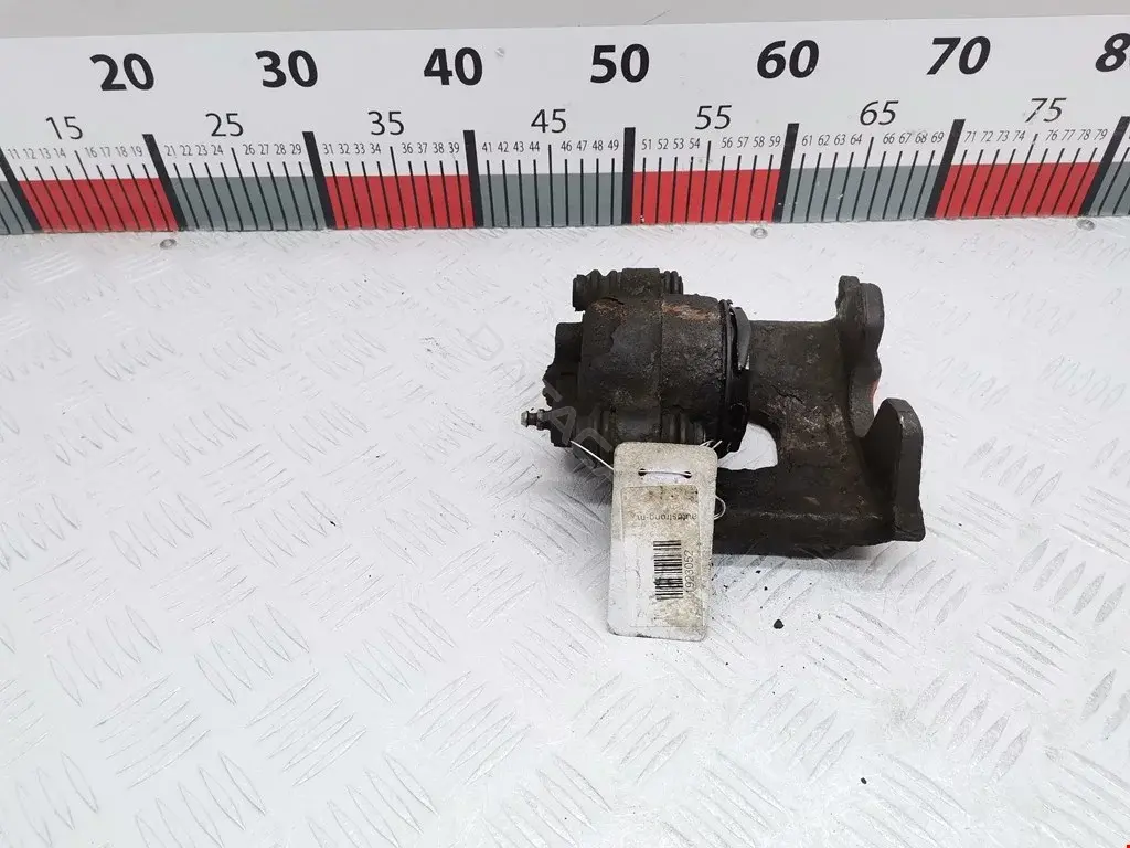 Суппорт тормозной 5010033AA