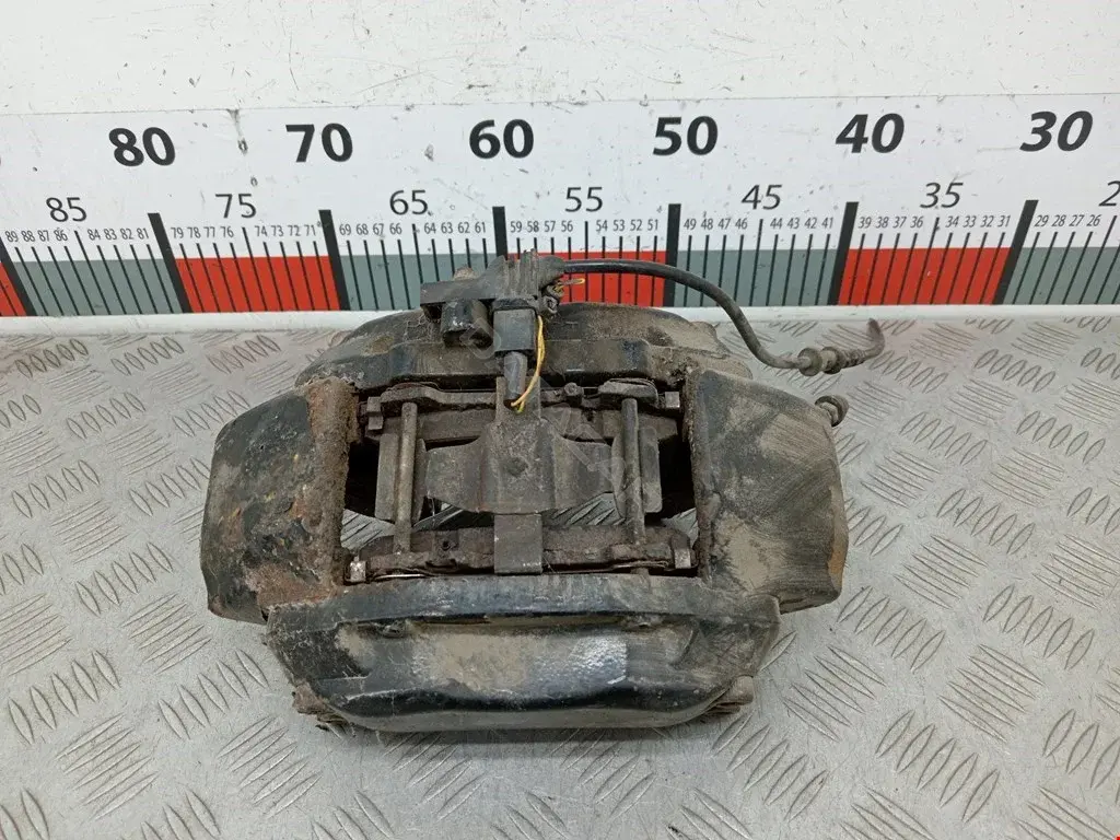 Суппорт тормозной 20704604, A0014208383, ME6228