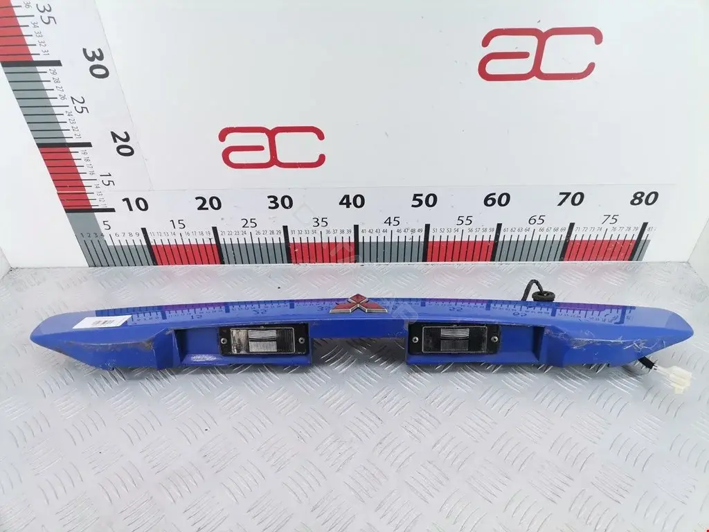 Фонарь подсветки номерного знака MR990264