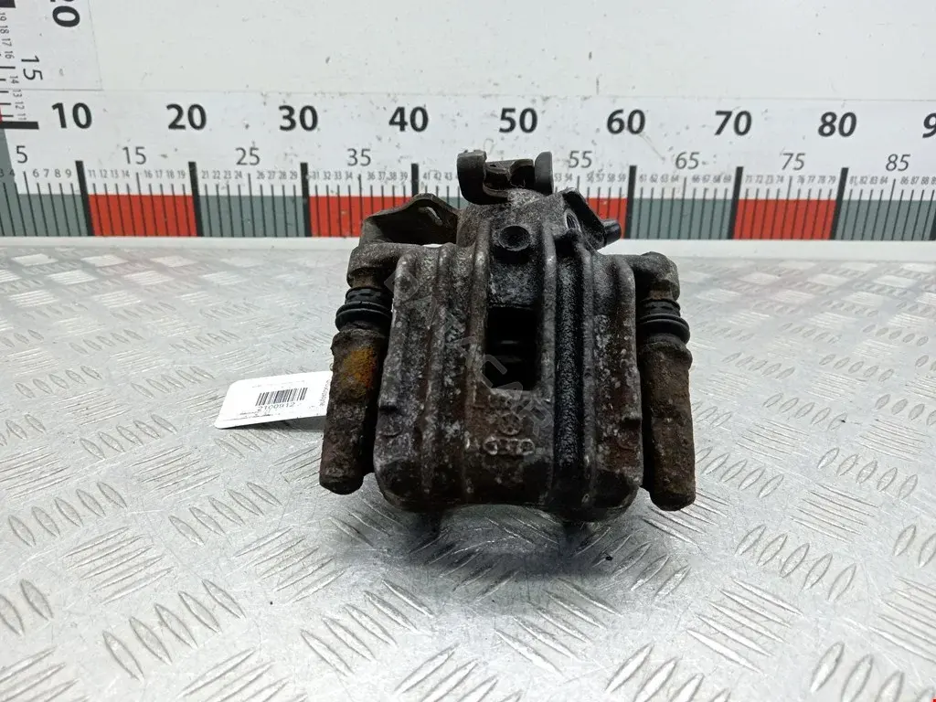 Суппорт тормозной 0590328SX, 0986473099, 100310005