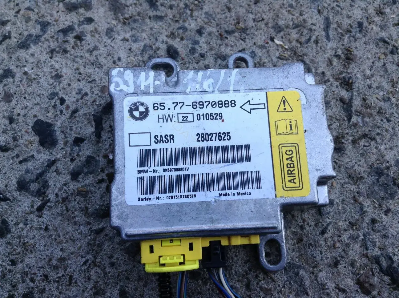 Датчик удара 65776970888, 6970888