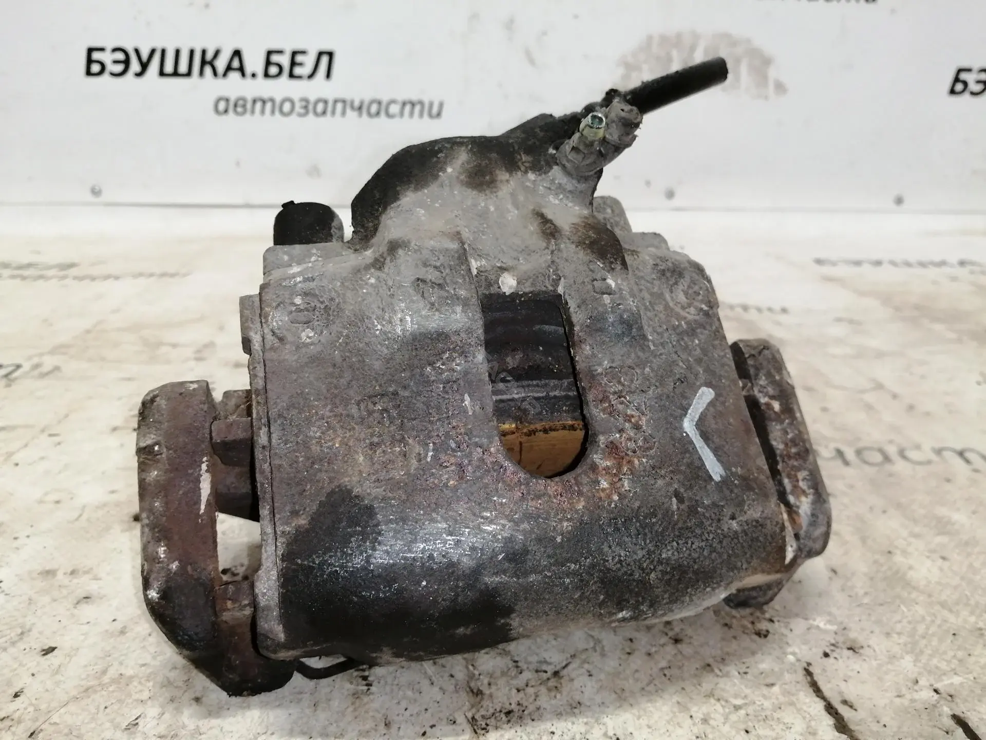 Суппорт тормозной 24354117695