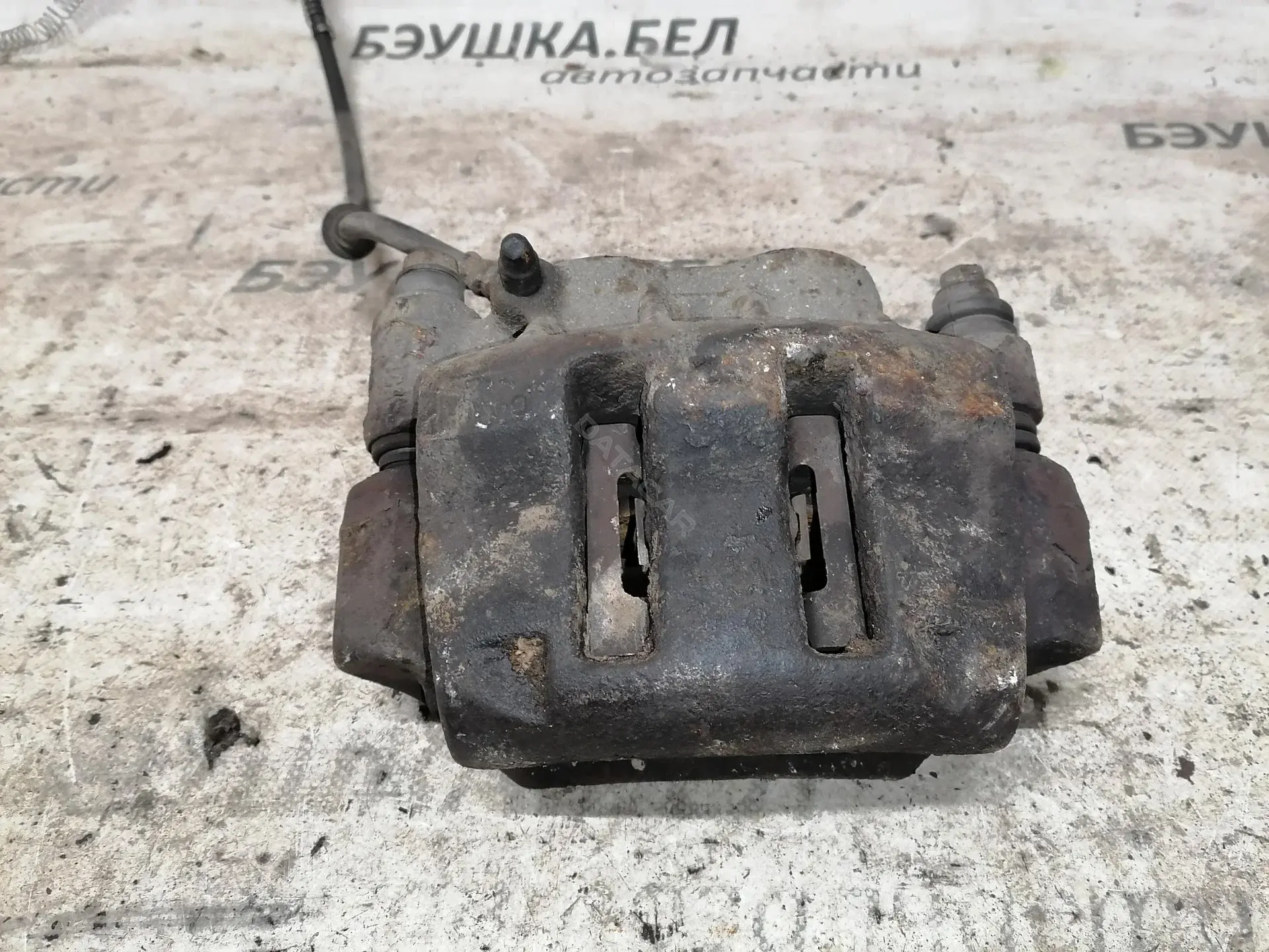 Суппорт тормозной 7701208013
