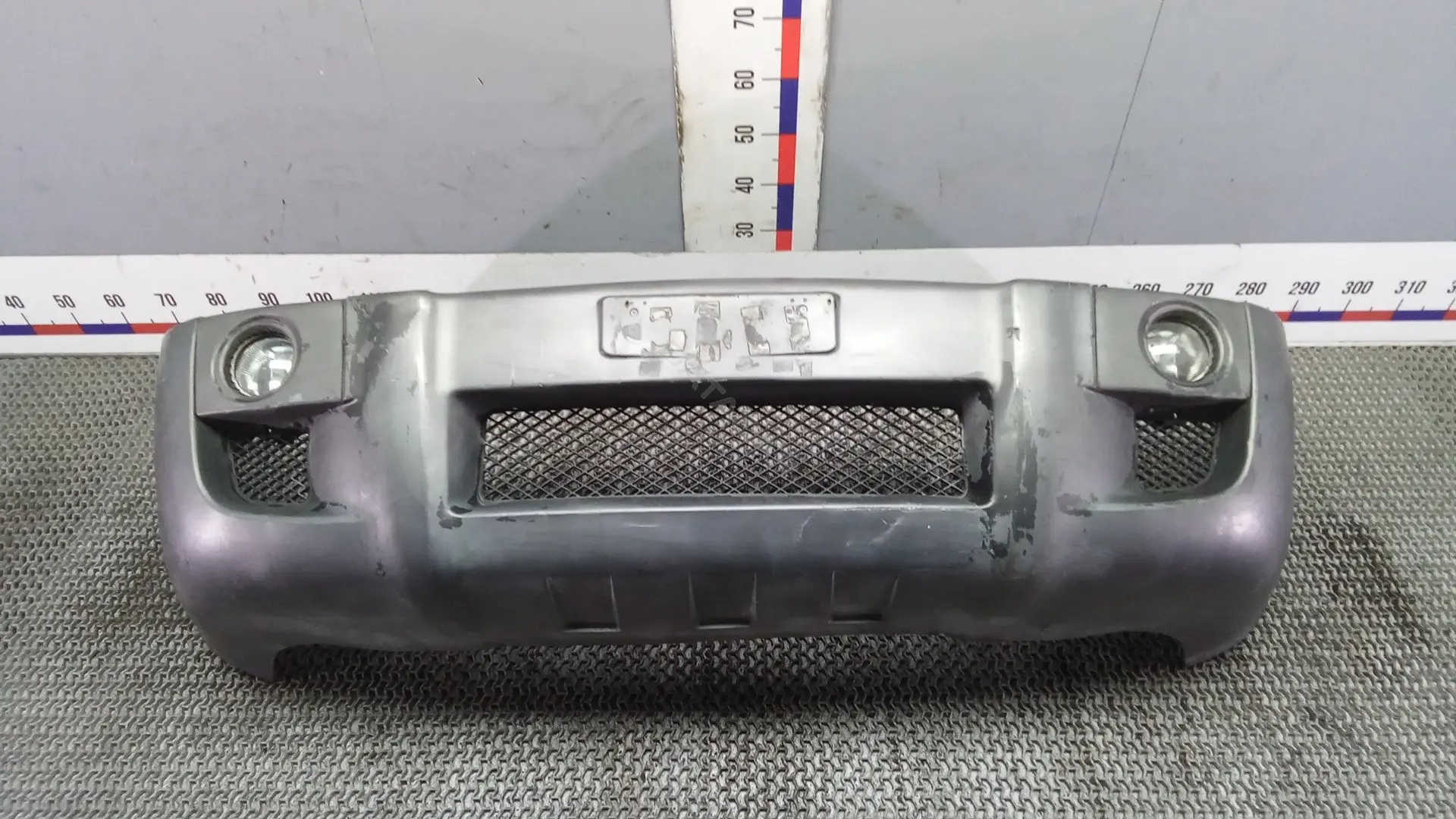 Передний бампер POK36G501