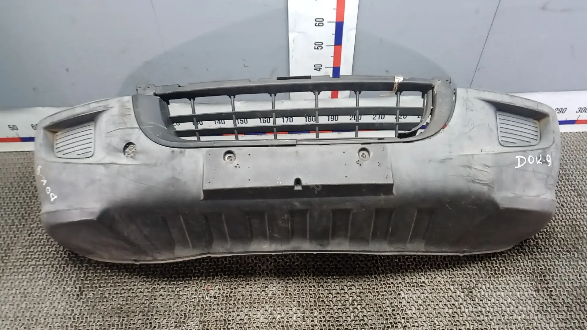 Передний бампер DOK09G501