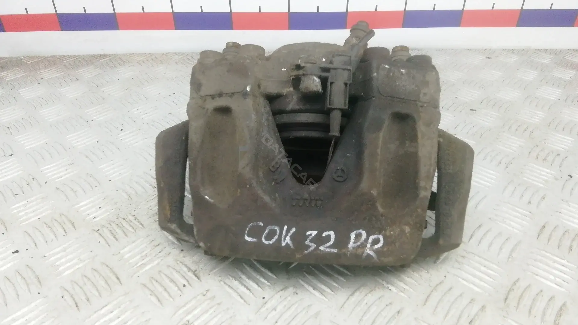Суппорт тормозной COK32N701