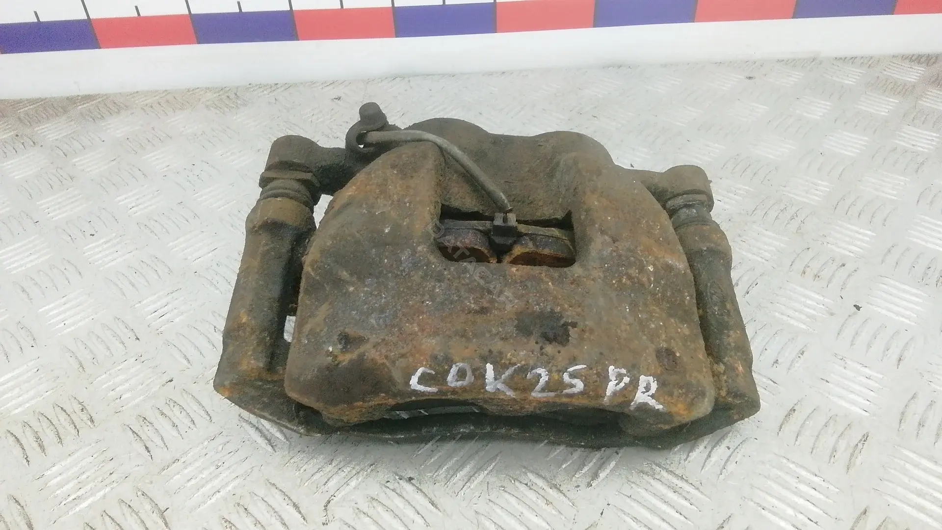 Суппорт тормозной COK25N701