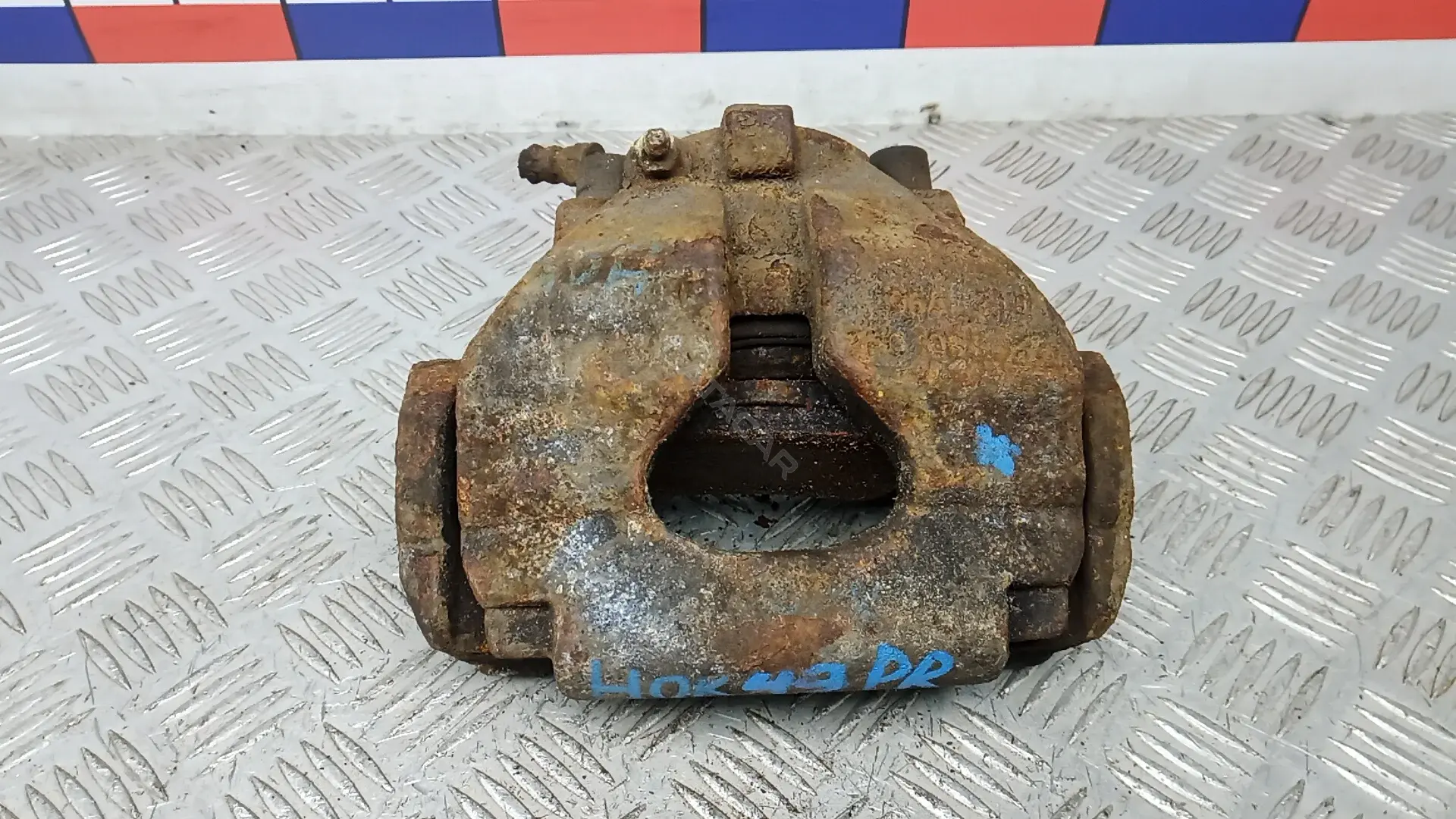 Суппорт тормозной HOK49N701