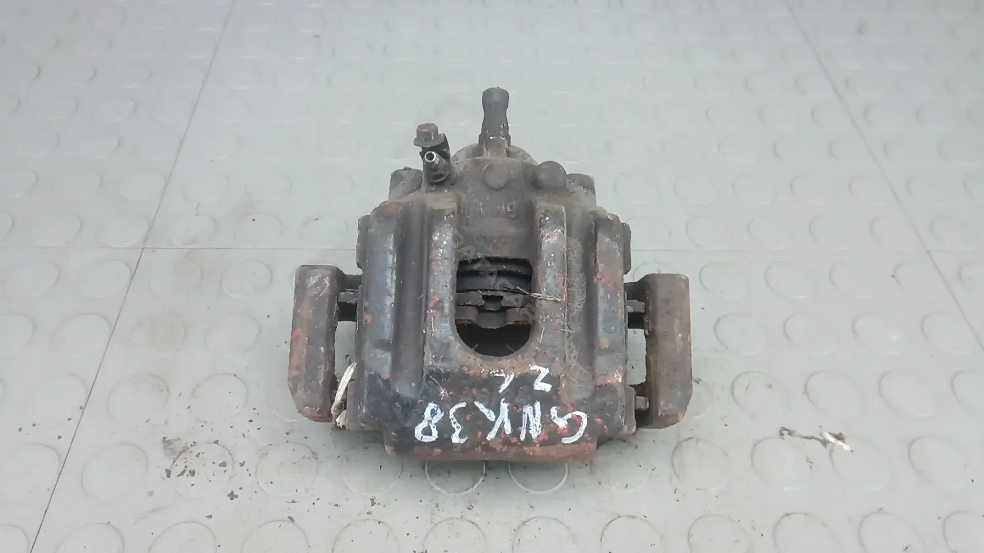 Суппорт тормозной GNK38MA01