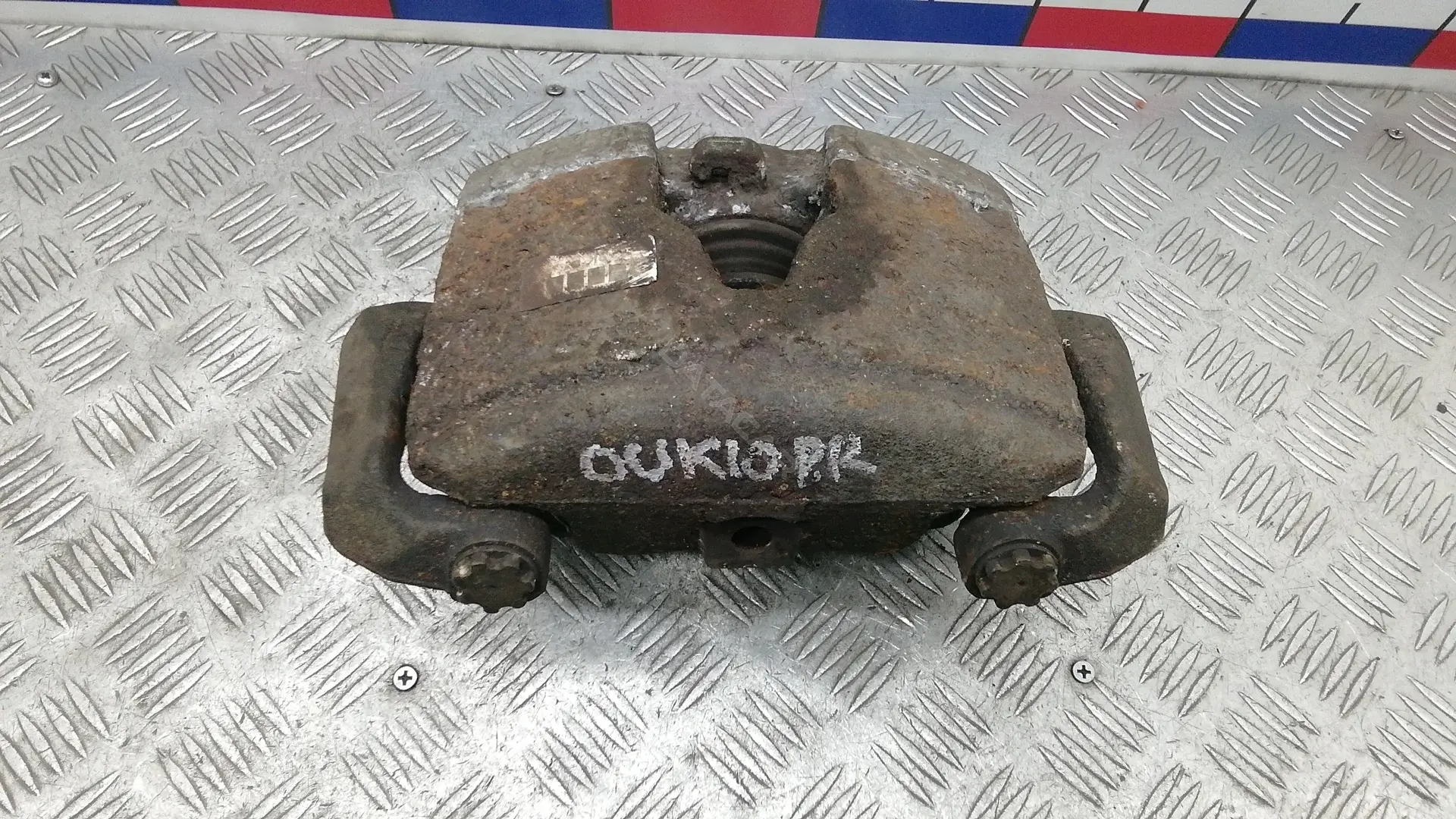 Суппорт тормозной OUK10N701