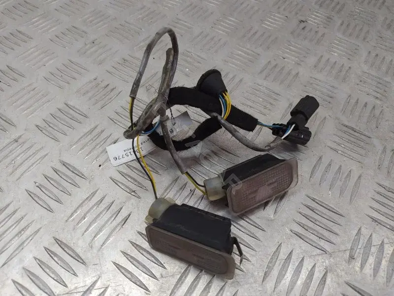 Фонарь подсветки номерного знака 6M2A13550AC