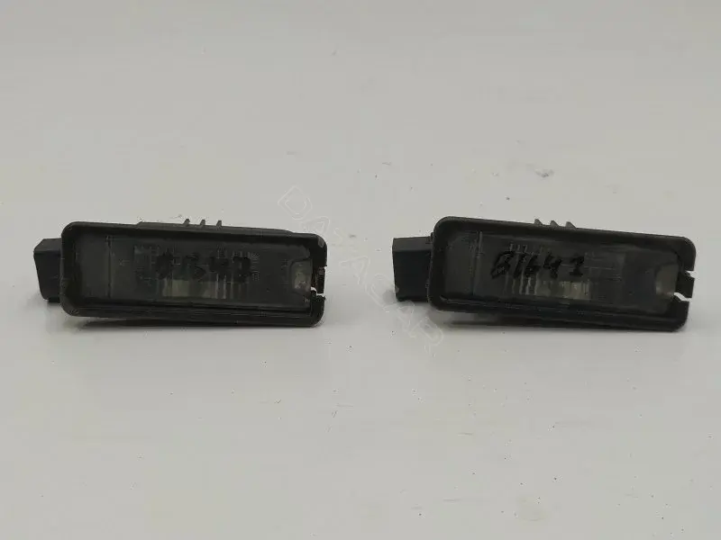 Фонарь подсветки номерного знака 1K8943021