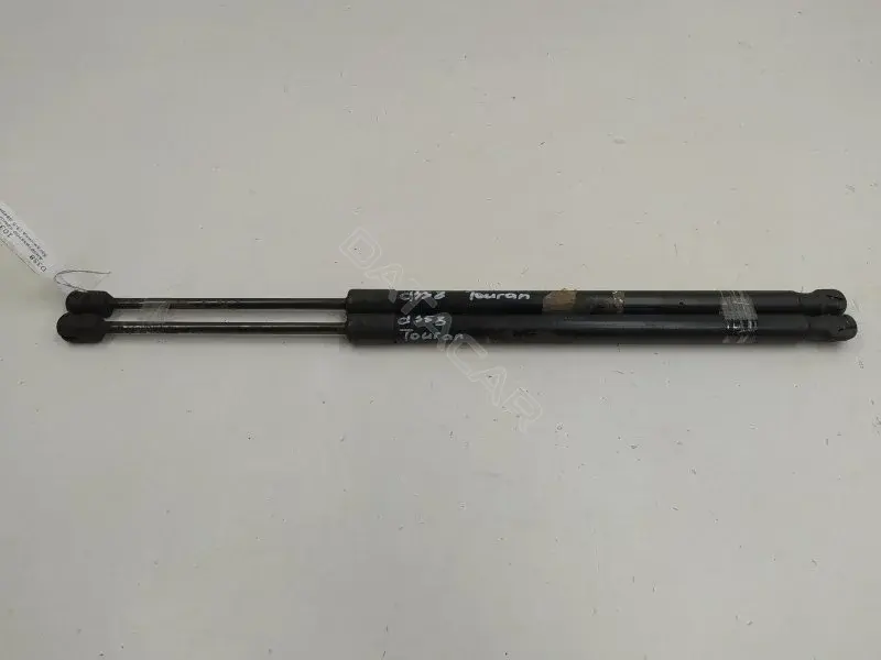 Амортизатор крышки багажника, капота, заднего стекла 1T0827550C