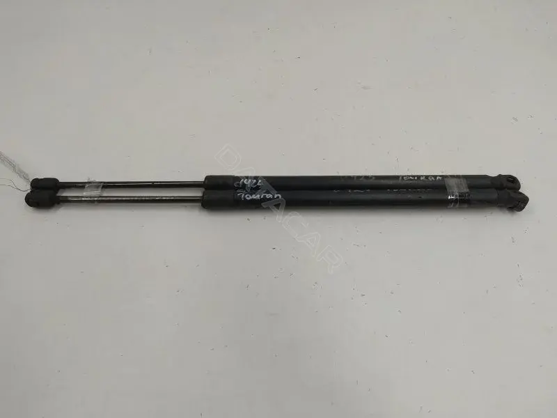 Амортизатор крышки багажника, капота, заднего стекла 1T0827550C