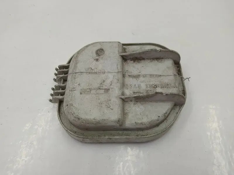 Заглушка фары 95AG13K060AA