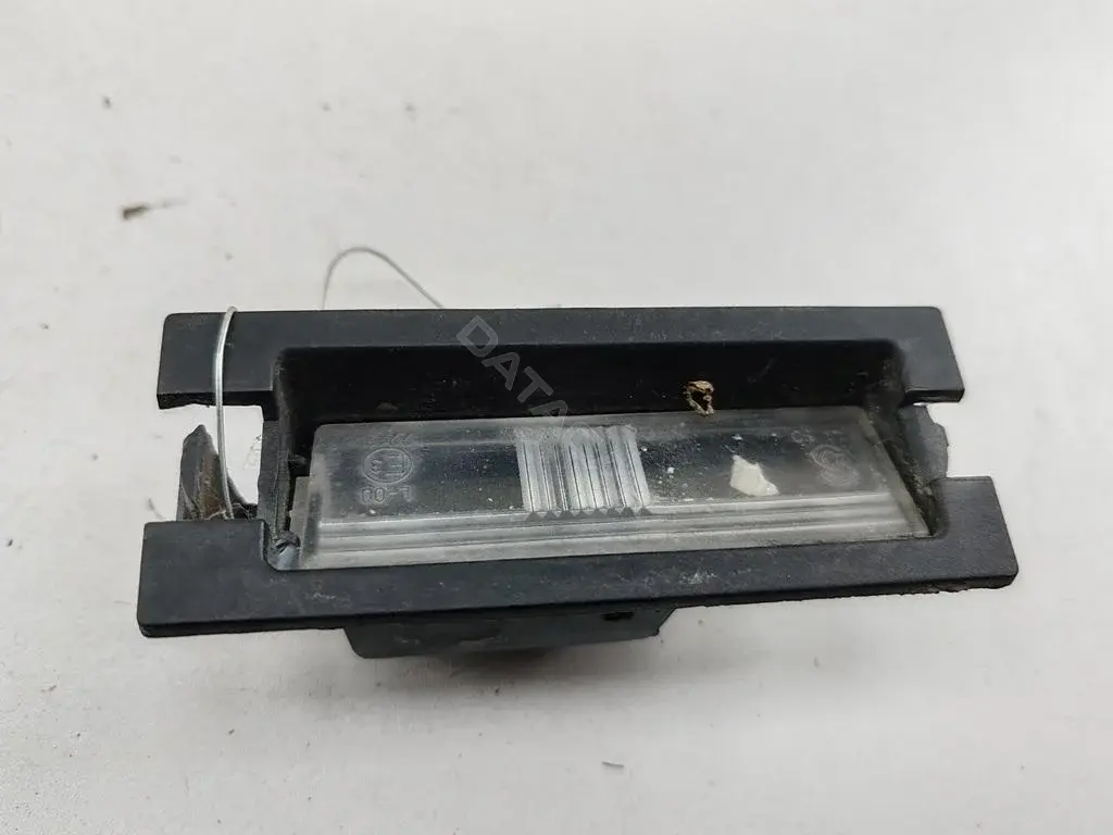 Фонарь подсветки номерного знака MR957364