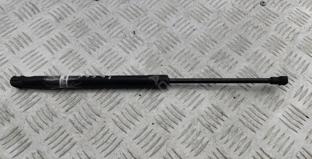 Амортизатор крышки багажника, капота, заднего стекла 1T0823359