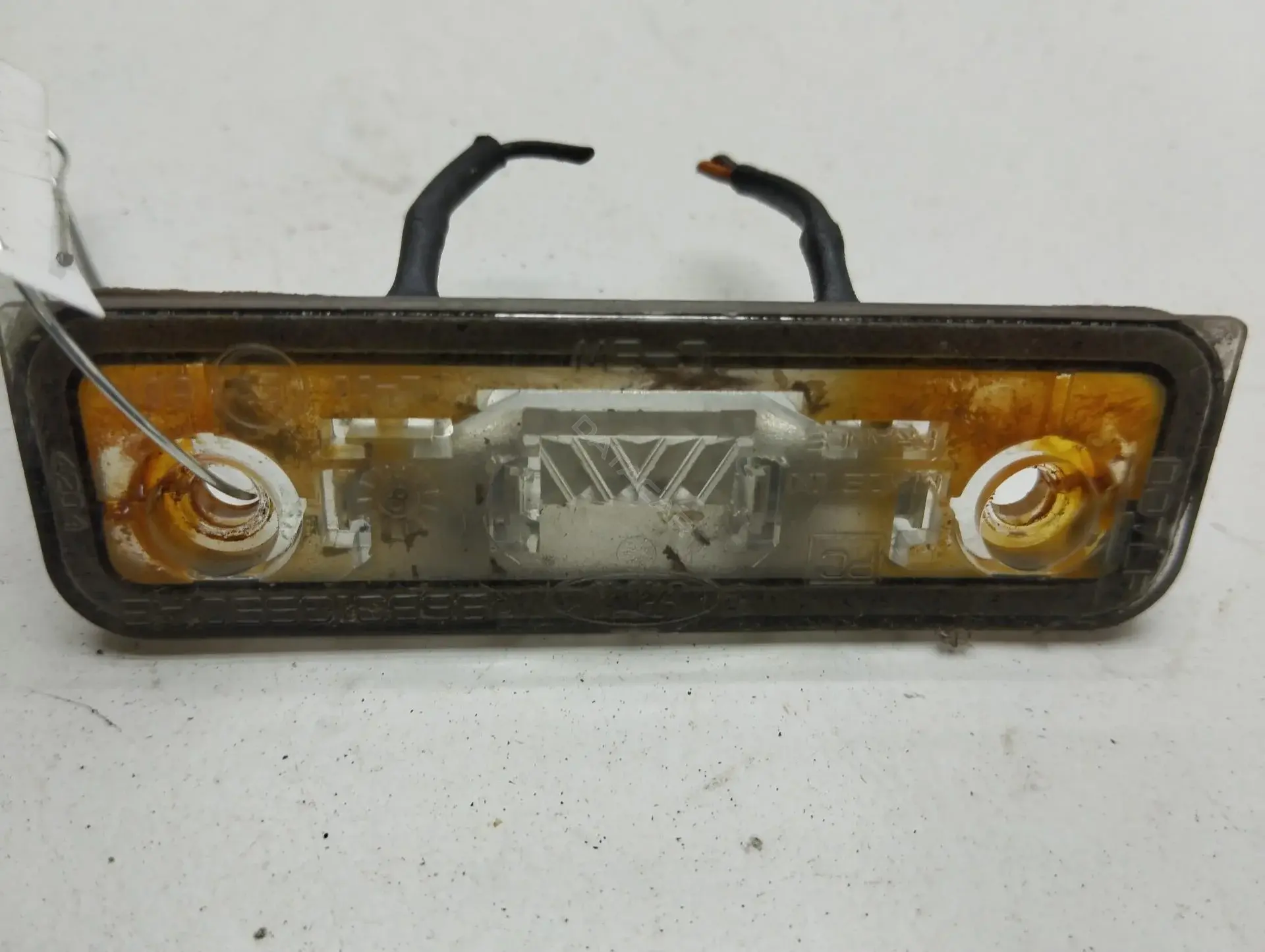 Фонарь подсветки номерного знака 96BG13550AB
