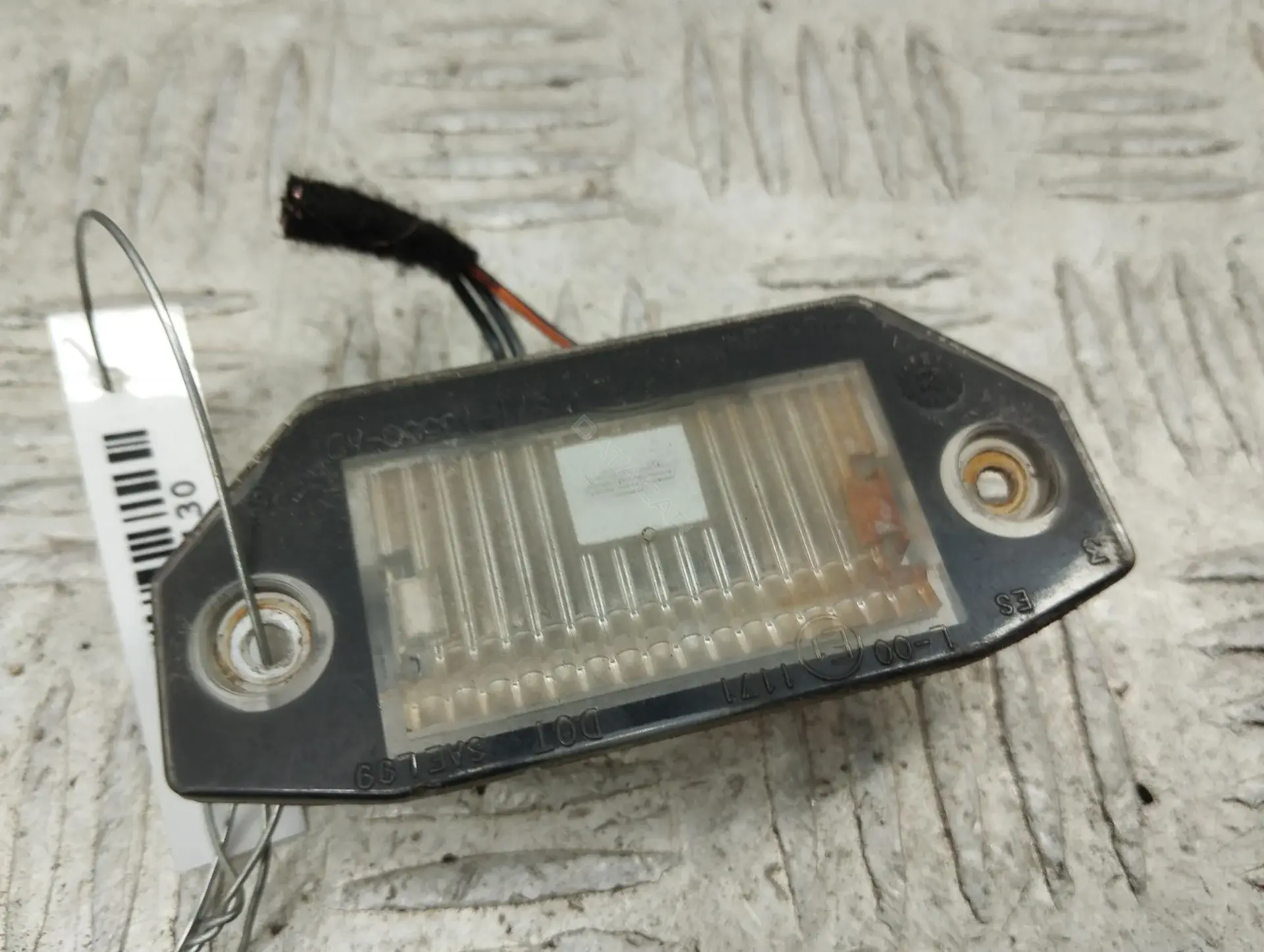 Фонарь подсветки номерного знака 1S7113550A