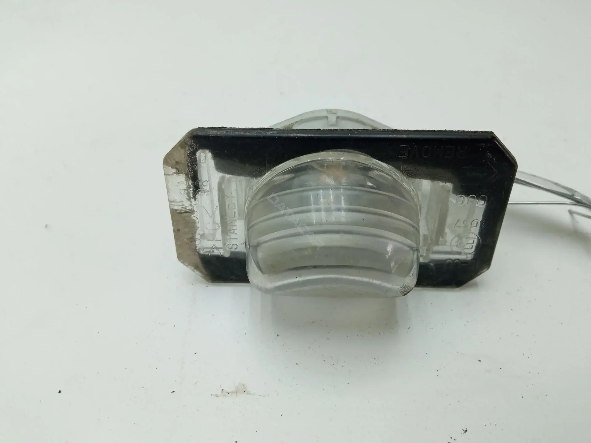 Фонарь подсветки номерного знака L004057