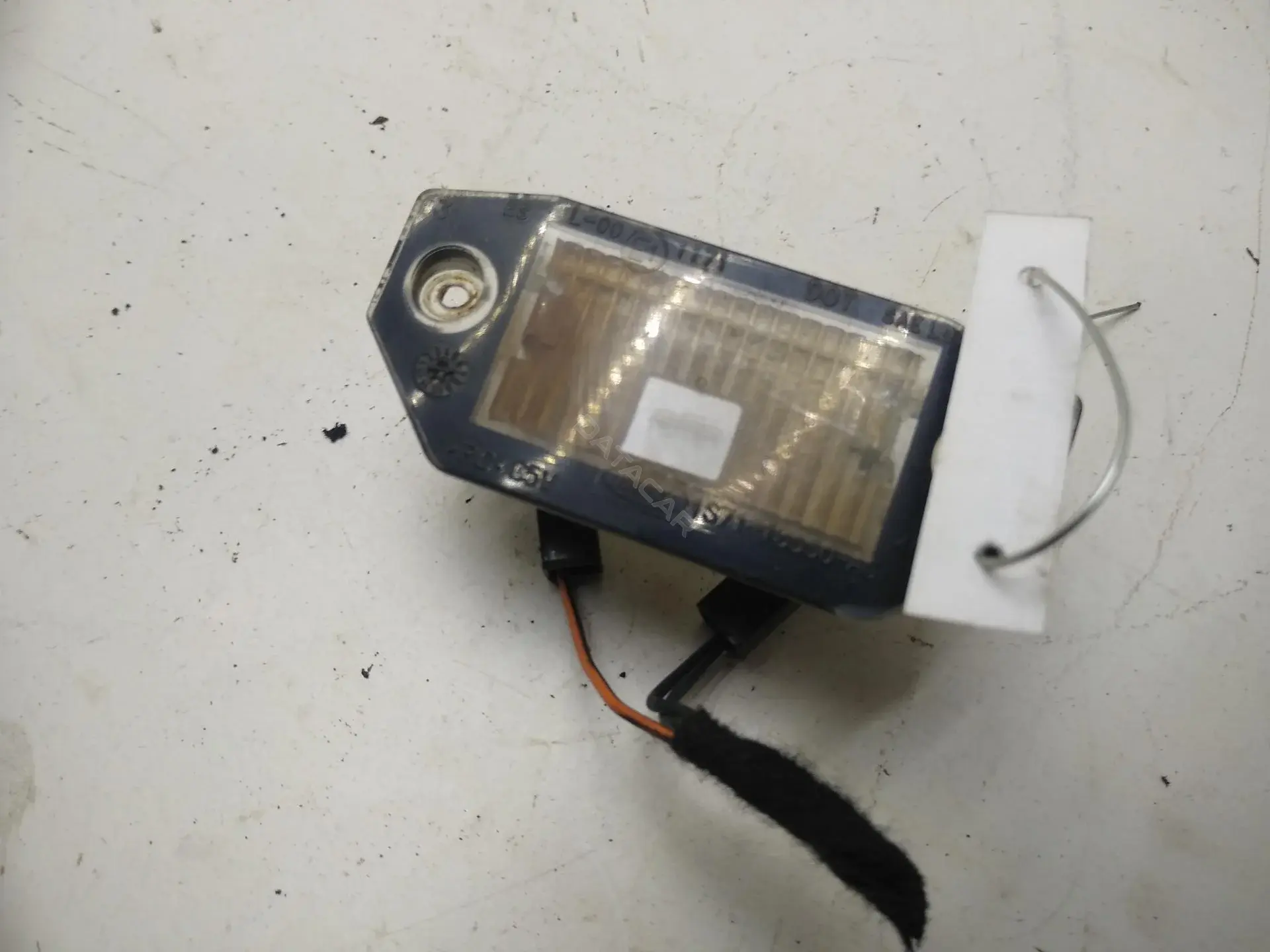Фонарь подсветки номерного знака 1S7113550AC