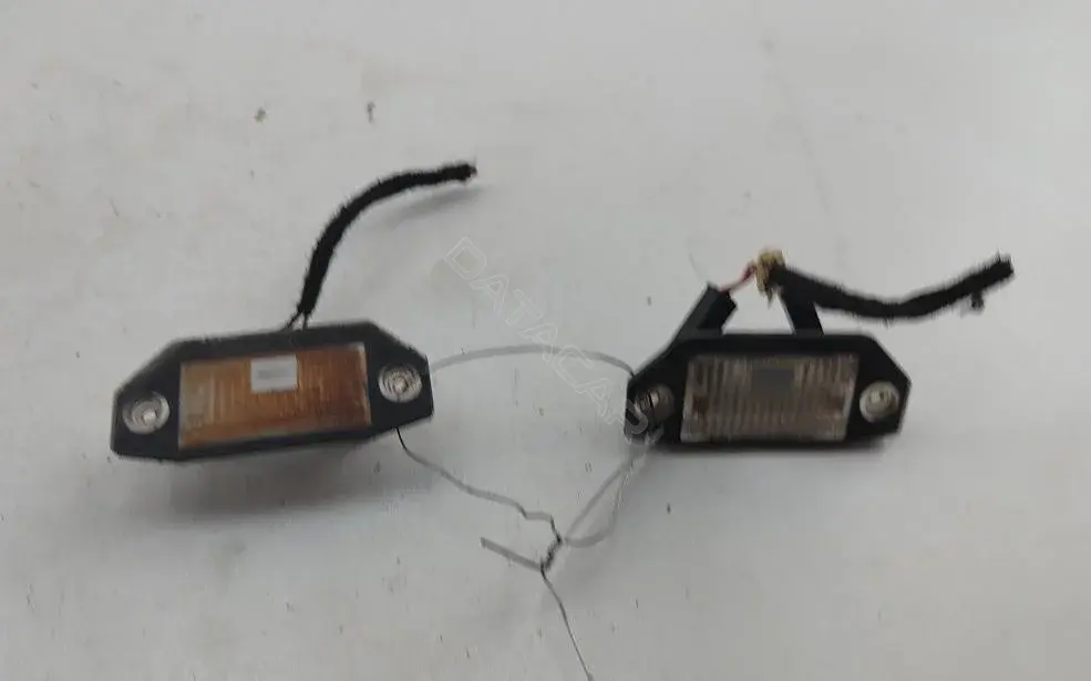 Фонарь подсветки номерного знака 1S7113550AC