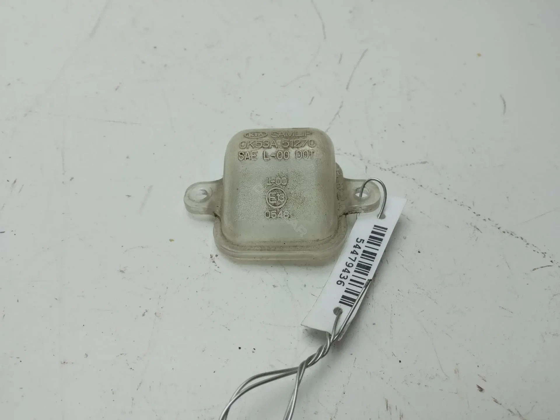Фонарь подсветки номерного знака OK53A51270