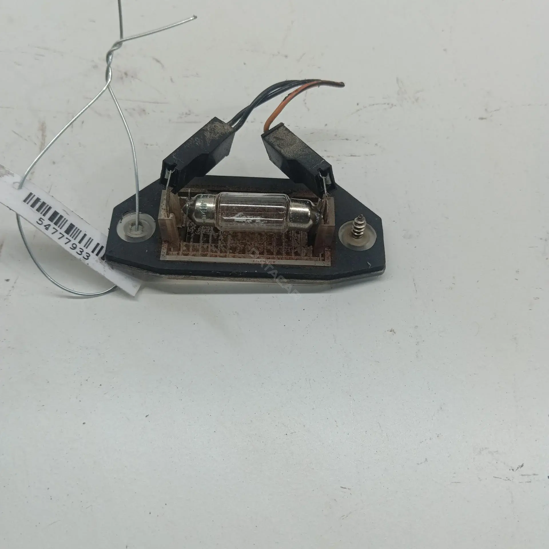 Фонарь подсветки номерного знака 1S7113550AD