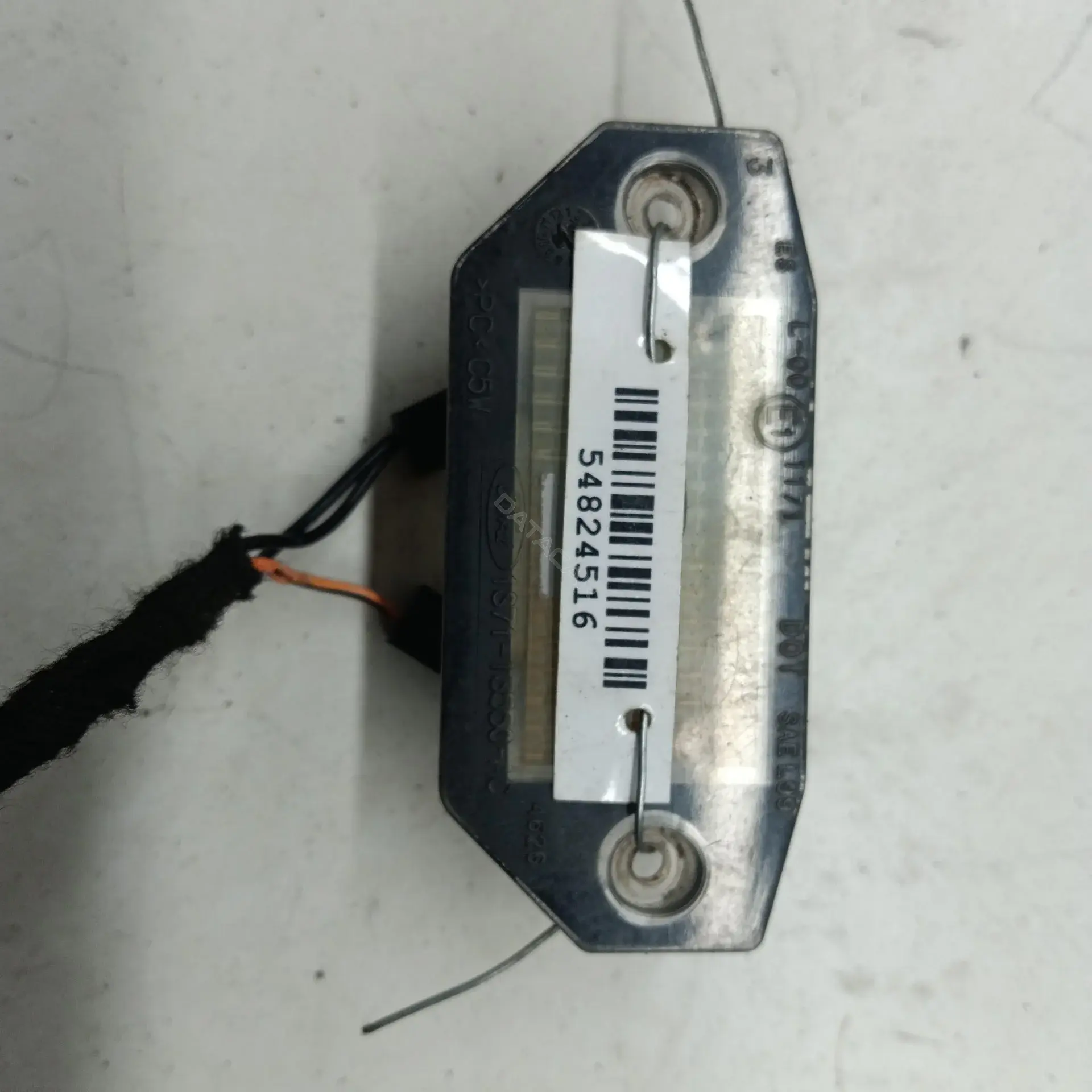 Фонарь подсветки номерного знака 1S7113550AC