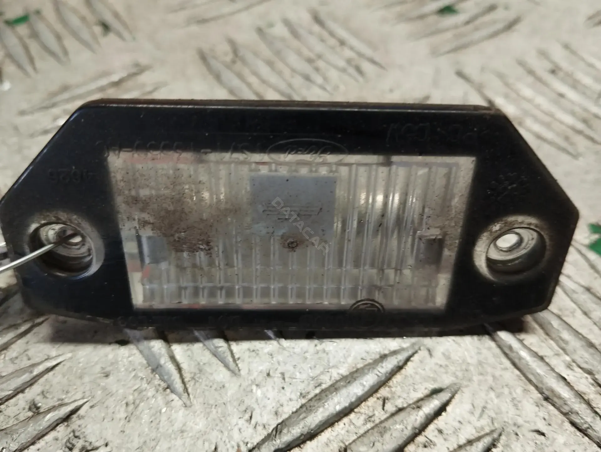 Фонарь подсветки номерного знака 1S7113550A