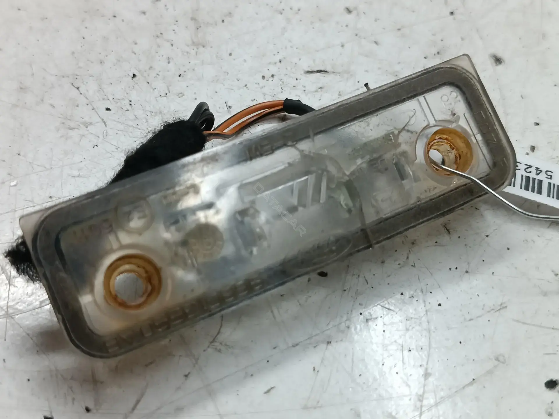Фонарь подсветки номерного знака 96BG13550AB