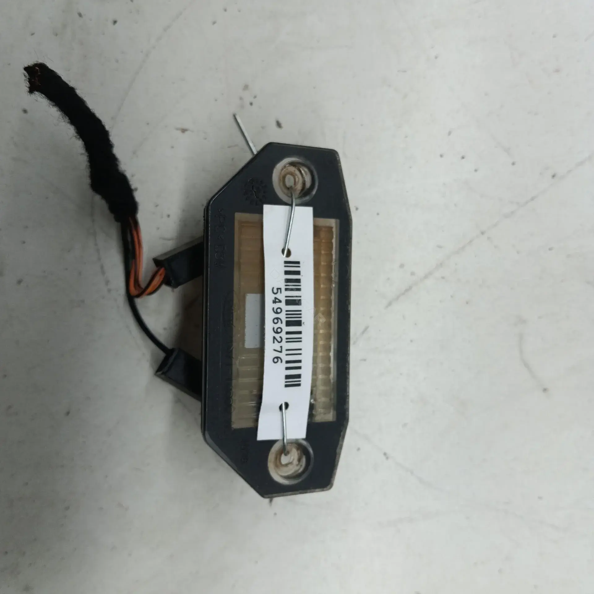 Фонарь подсветки номерного знака 1S7113550AC