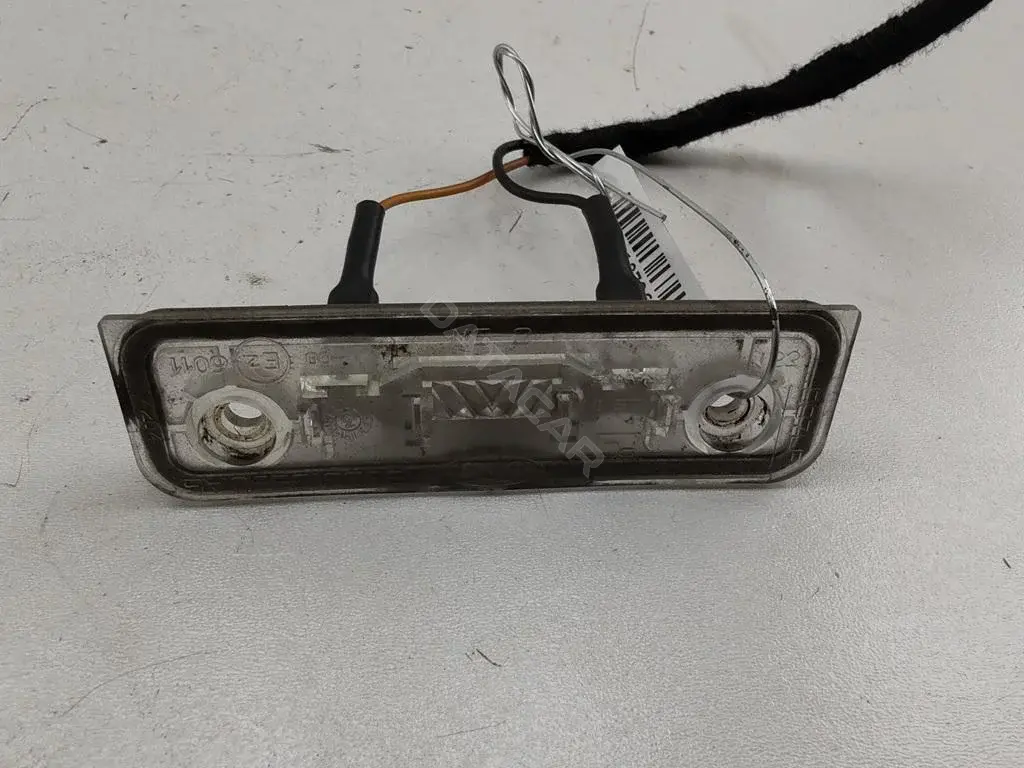 Фонарь подсветки номерного знака 96BG13550AB