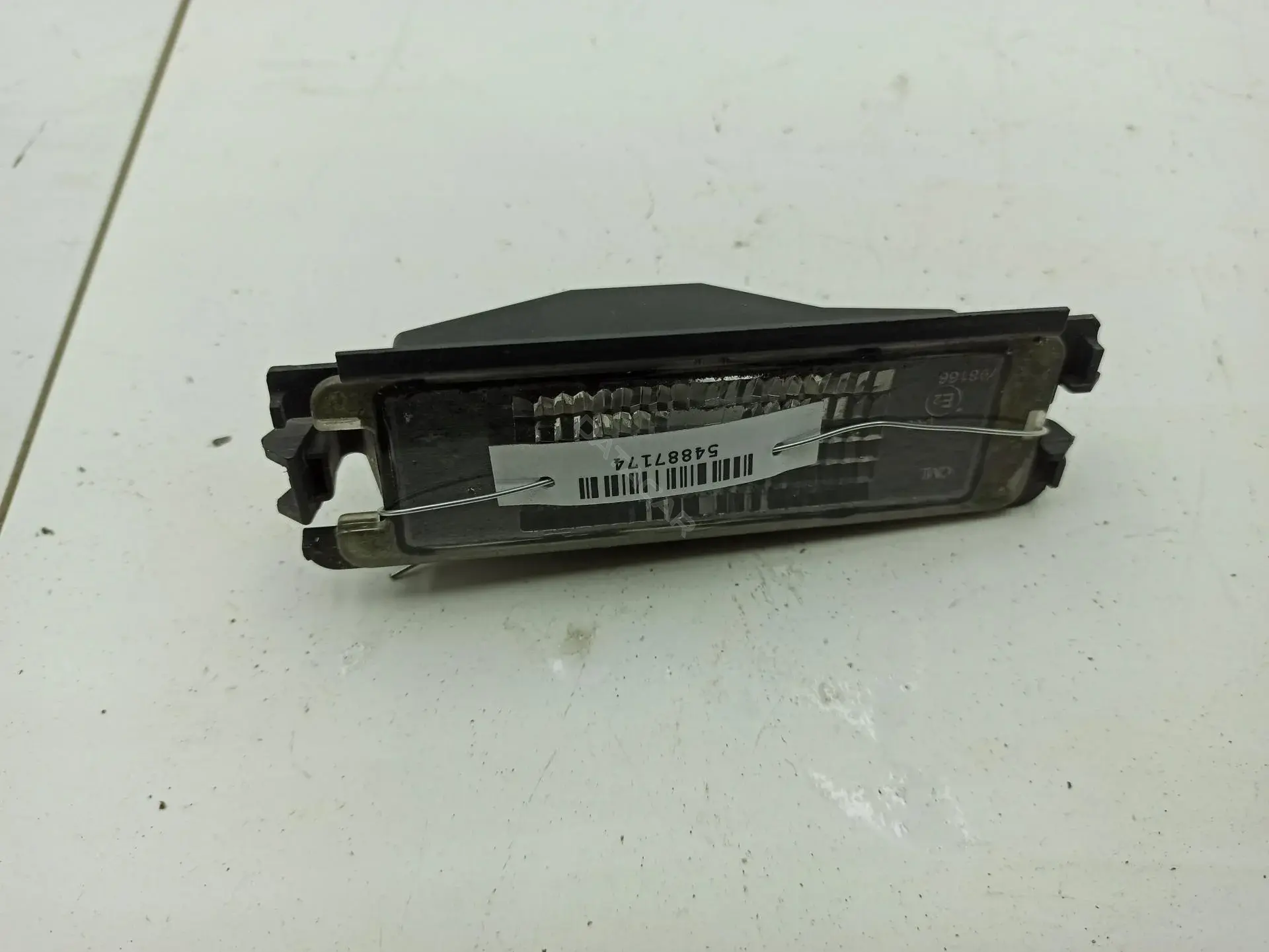 Фонарь подсветки номерного знака 8200957874