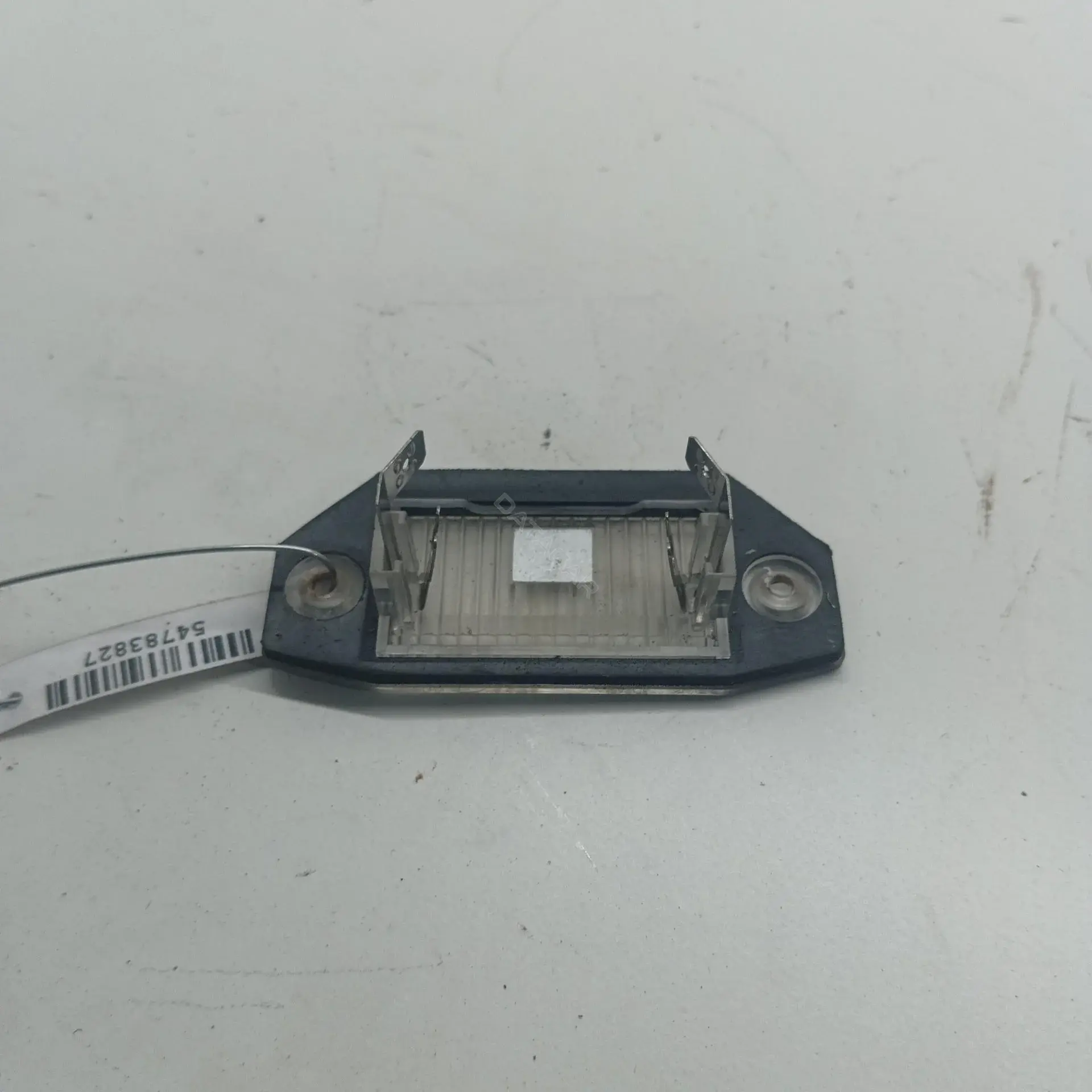 Фонарь подсветки номерного знака 1S7113550AC