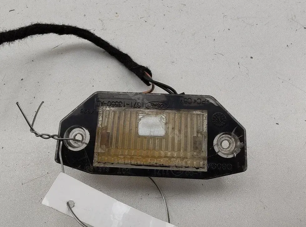 Фонарь подсветки номерного знака 1S7113550AD