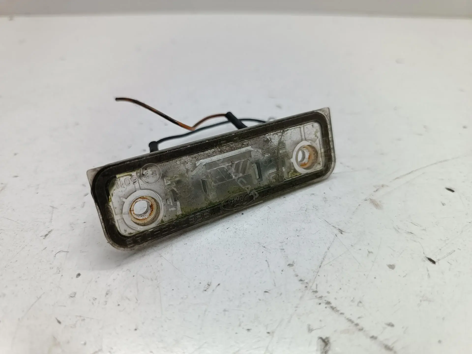 Фонарь подсветки номерного знака 95BG13550AB
