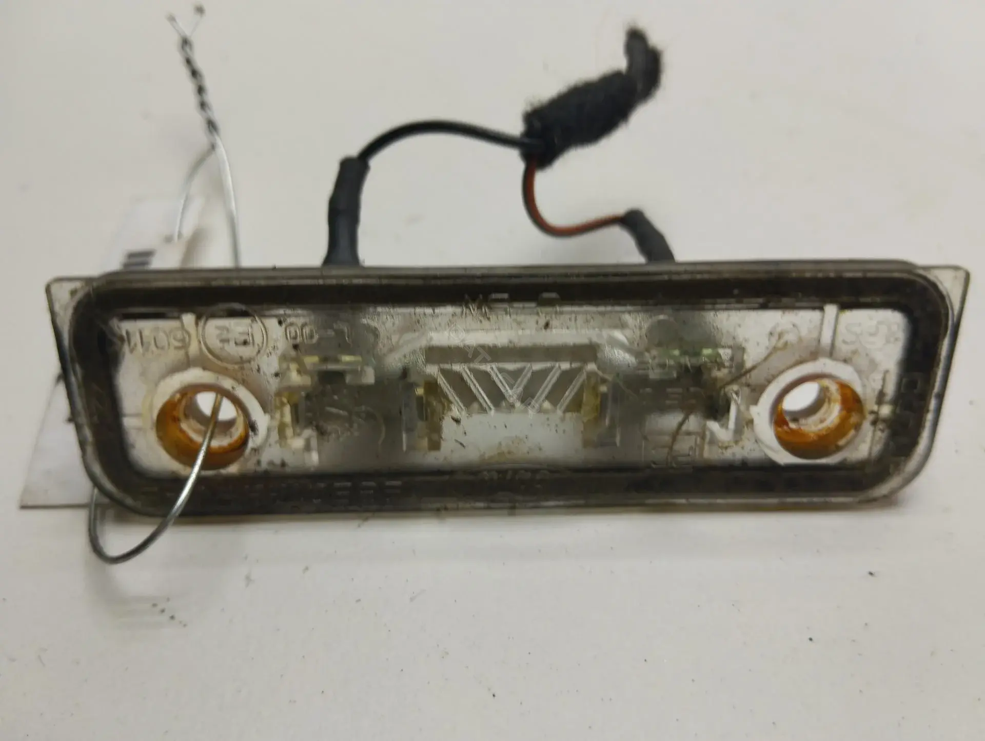 Фонарь подсветки номерного знака 96BG13550AB