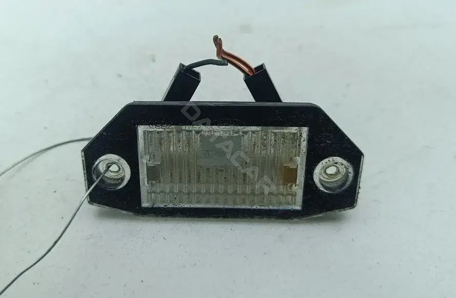 Фонарь подсветки номерного знака 1S7113550AC