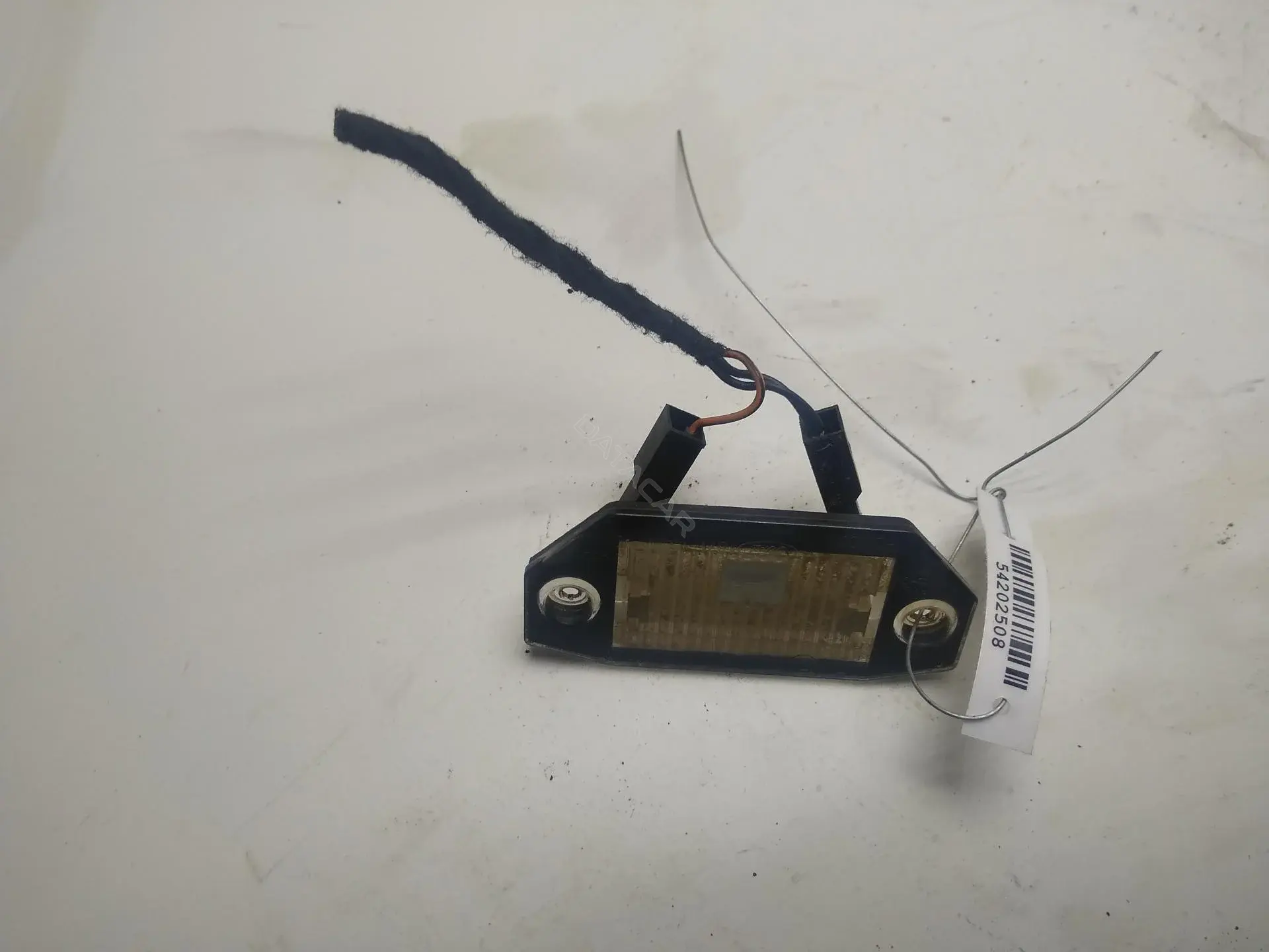 Фонарь подсветки номерного знака 1S7113550AD