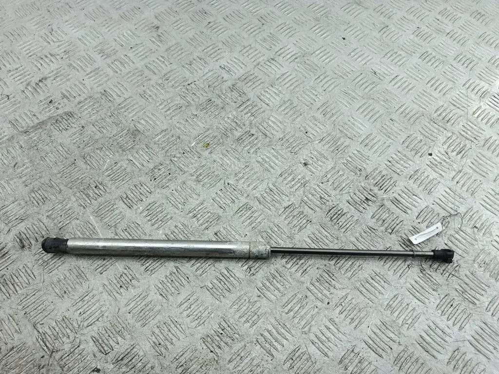 Амортизатор крышки багажника, капота, заднего стекла 1J0823359