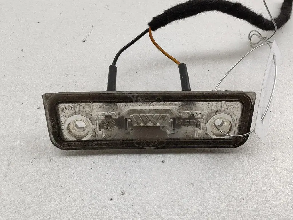 Фонарь подсветки номерного знака 96BG13550AB