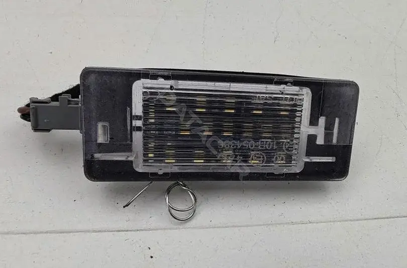 Фонарь подсветки номерного знака 10R-054386