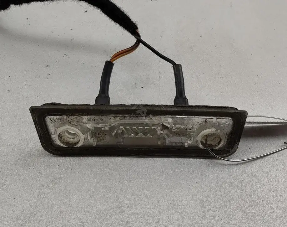 Фонарь подсветки номерного знака 96BG13550AB