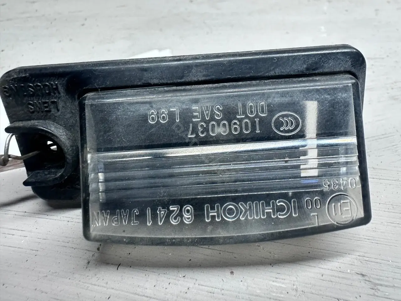 Фонарь подсветки номерного знака 26510-AR00A