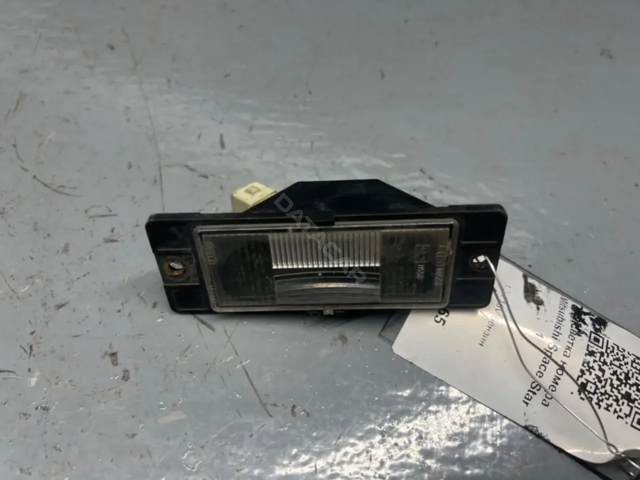 Фонарь подсветки номерного знака MR245531