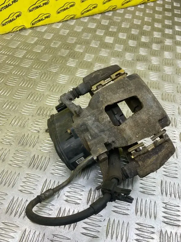 Суппорт тормозной JL1Z2552A