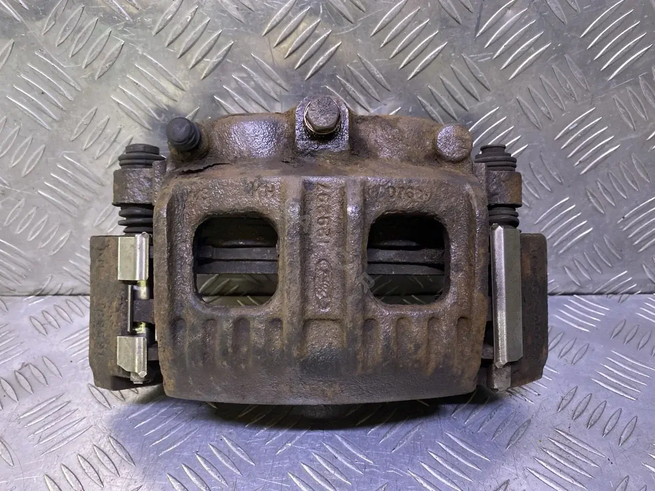 Суппорт тормозной F75Z2B121AF